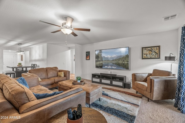 living room with carpet flooring and ceiling fan