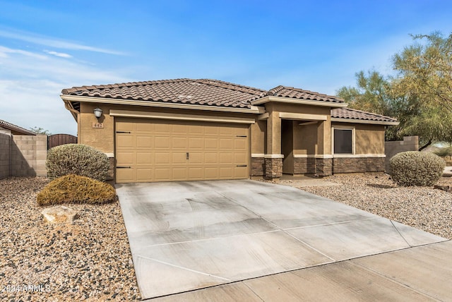 view of front of property with a garage