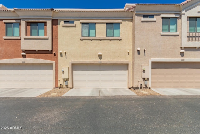 125 N Sunvalley Blvd Unit 119, Mesa, AZ 85207 - multi unit property featuring stucco siding, a garage, and driveway