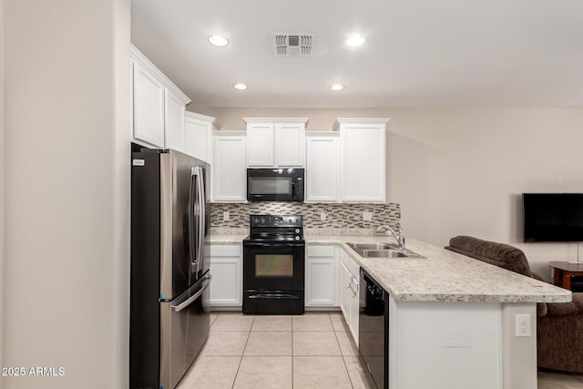 125 N Sunvalley Blvd Unit 119, Mesa, AZ 85207 - kitchen with black appliances, a peninsula, white cabinetry, decorative backsplash, and recessed lighting