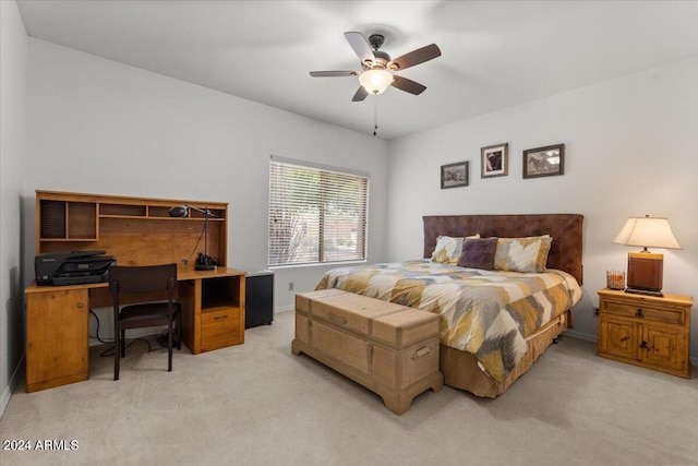 bedroom with ceiling fan and light carpet