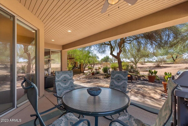 view of patio with ceiling fan and grilling area