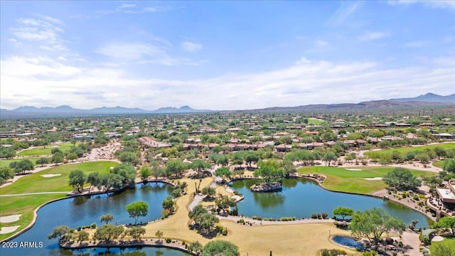 birds eye view of property featuring a water and mountain view