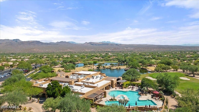 bird's eye view with a water and mountain view