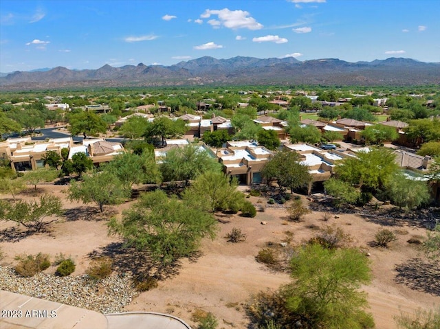 birds eye view of property featuring a mountain view