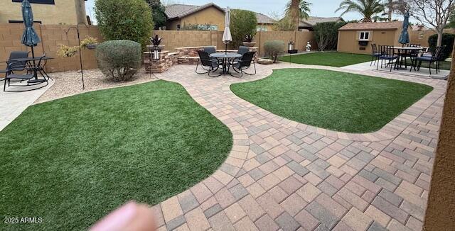 view of yard with a patio area and a fenced backyard