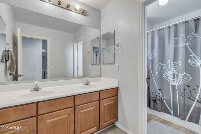 bathroom featuring hardwood / wood-style floors and vanity