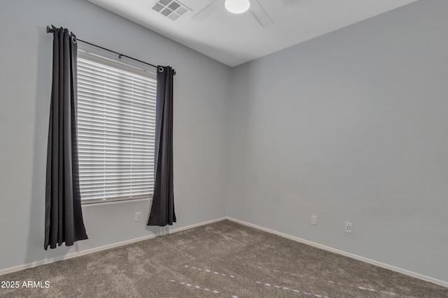 unfurnished room with ceiling fan and carpet floors