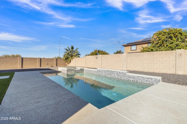 view of swimming pool featuring an in ground hot tub