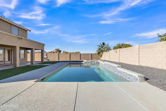 view of pool with an in ground hot tub and a patio