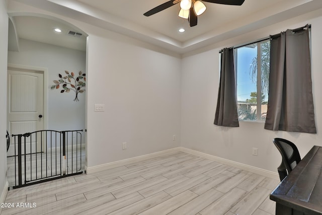 office area featuring light hardwood / wood-style flooring and ceiling fan