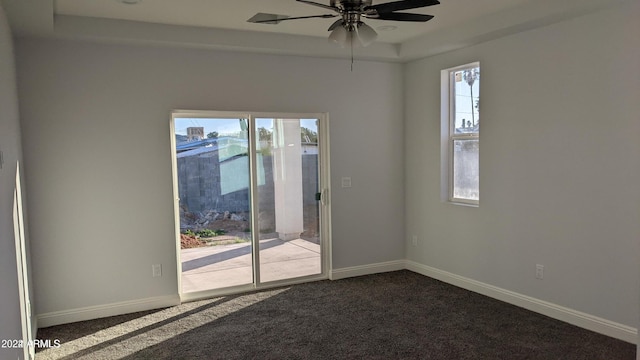 carpeted empty room featuring ceiling fan