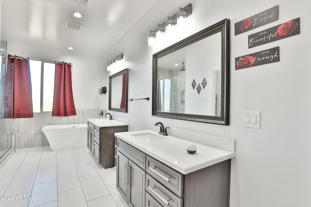 bathroom featuring tile patterned flooring, vanity, and independent shower and bath