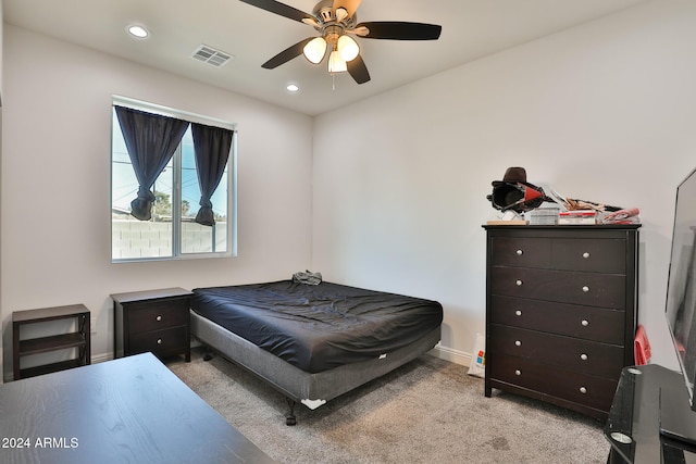 bedroom featuring ceiling fan and light colored carpet