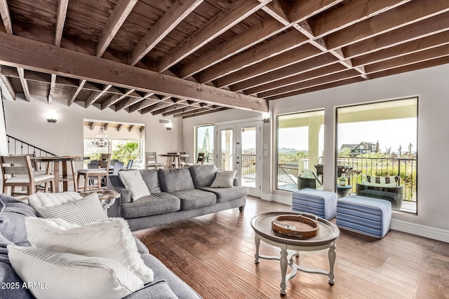 36723 N 33rd Ave, Phoenix, AZ 85086 - living area featuring wood finished floors, french doors, an inviting chandelier, and beam ceiling