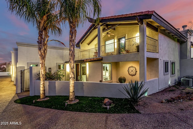 36723 N 33rd Ave, Phoenix, AZ 85086 - view of side of home with a balcony, cooling unit, and stucco siding