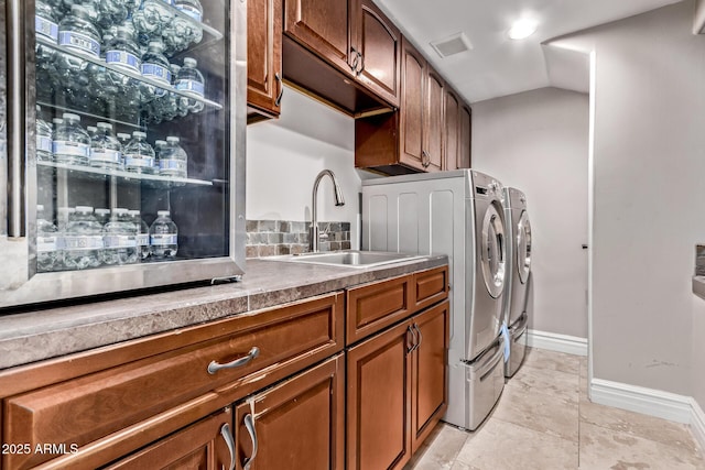 36723 N 33rd Ave, Phoenix, AZ 85086 - laundry room featuring washer and clothes dryer, light tile patterned floors, baseboards, a sink, and visible vents