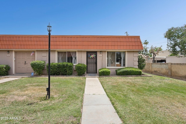 5154 N 83rd St, Scottsdale, AZ 85250 - view of property with mansard roof, brick siding, and a tile roof