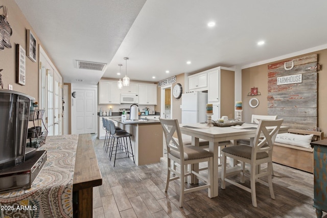 5154 N 83rd St, Scottsdale, AZ 85250 - dining room featuring light wood-style flooring and recessed lighting