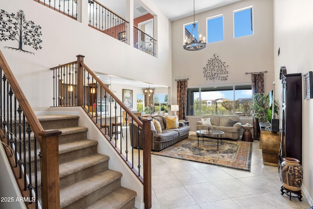 31156 N 137th Ln, Peoria, AZ 85383 - tiled living room with a chandelier, a towering ceiling, stairway, and baseboards