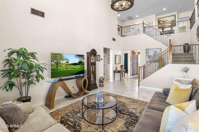 31156 N 137th Ln, Peoria, AZ 85383 - living area featuring stairs, baseboards, recessed lighting, a high ceiling, and a chandelier