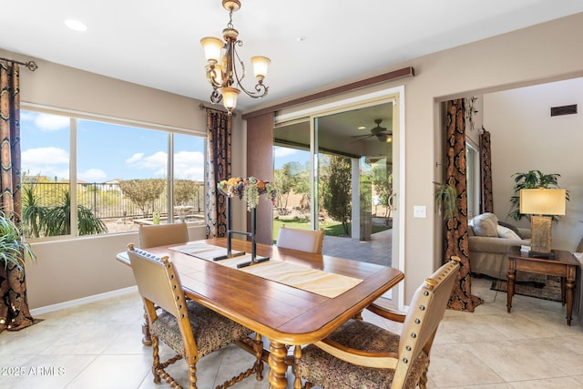 31156 N 137th Ln, Peoria, AZ 85383 - dining area with a chandelier, a ceiling fan, light tile patterned floors, and baseboards