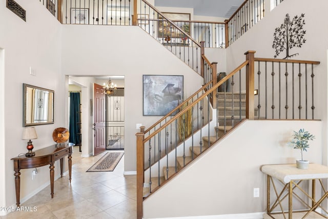 31156 N 137th Ln, Peoria, AZ 85383 - staircase with a towering ceiling, baseboards, a chandelier, and tile patterned floors