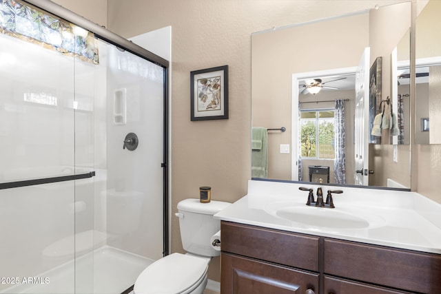 31156 N 137th Ln, Peoria, AZ 85383 - bathroom featuring a stall shower, toilet, a ceiling fan, and vanity