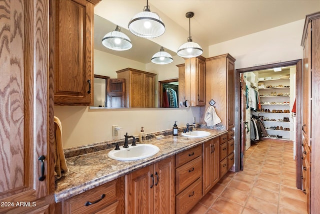 bathroom featuring tile patterned flooring and vanity