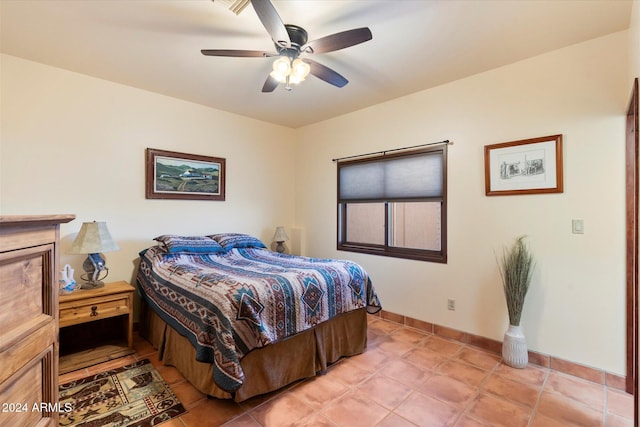 bedroom with light tile patterned floors and ceiling fan