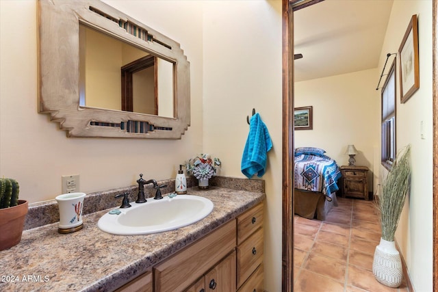 bathroom featuring tile patterned flooring and vanity