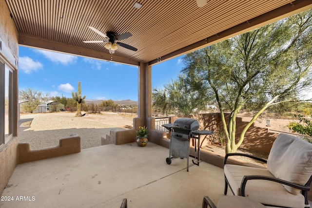 view of patio / terrace with ceiling fan and a grill