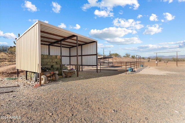 view of outbuilding featuring a rural view