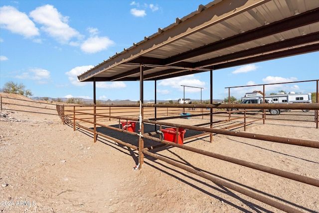 exterior space featuring a rural view and an outdoor structure