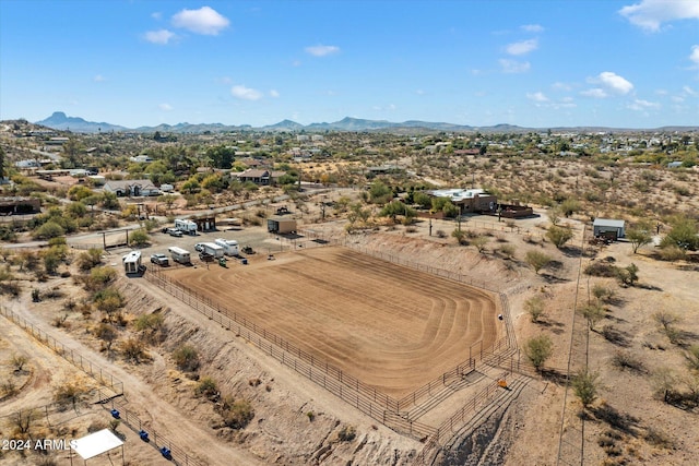 birds eye view of property with a mountain view