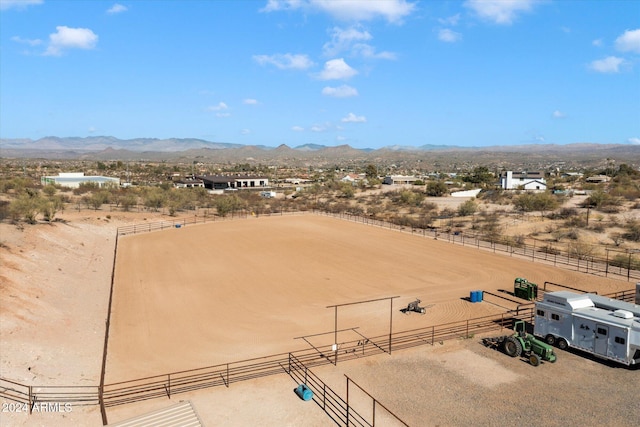 birds eye view of property with a mountain view