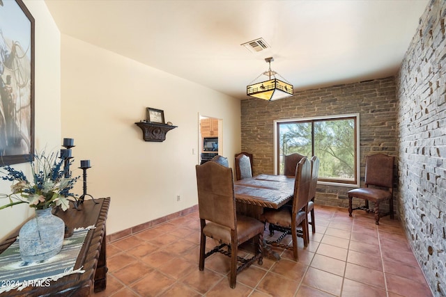 dining room featuring tile patterned flooring