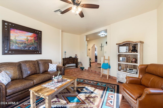 living room with tile patterned floors and ceiling fan