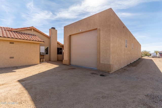 garage featuring driveway