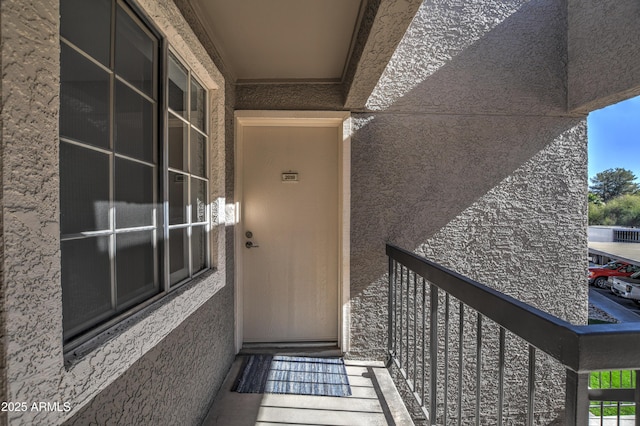 property entrance with a balcony