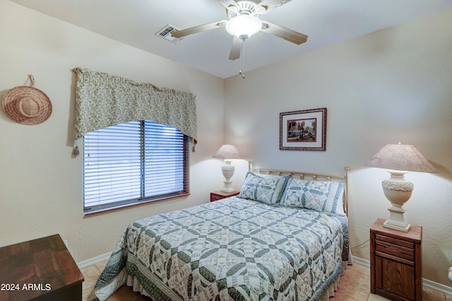 bedroom with light tile patterned floors and ceiling fan