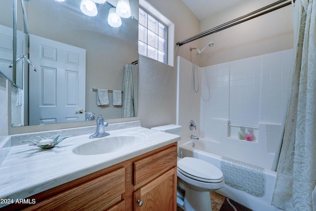 full bathroom with vanity, shower / bath combination with curtain, and toilet