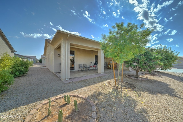 back of property with a patio area