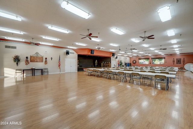 misc room with a textured ceiling and light hardwood / wood-style flooring