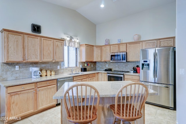 kitchen featuring decorative backsplash, light brown cabinets, sink, and stainless steel appliances