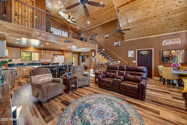 3334 Sawmill Ridge Loop, Heber, AZ 85928 - living room featuring high vaulted ceiling, a ceiling fan, wood ceiling, light wood-style floors, and stairs