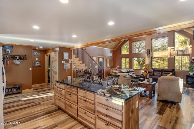 3334 Sawmill Ridge Loop, Heber, AZ 85928 - kitchen with light wood-style floors, dark stone counters, recessed lighting, open floor plan, and a kitchen island