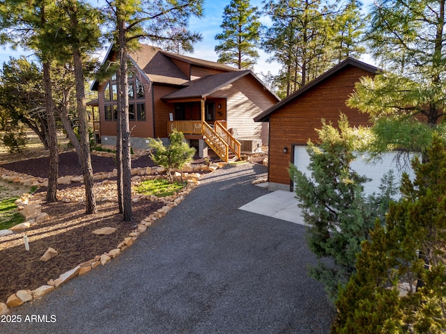 3334 Sawmill Ridge Loop, Heber, AZ 85928 - rustic home featuring a shingled roof, driveway, and stairway