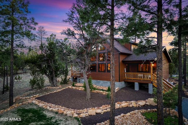 3334 Sawmill Ridge Loop, Heber, AZ 85928 - rear view of house featuring covered porch, stairs, and roof with shingles