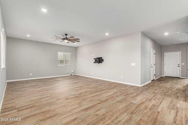 unfurnished room with ceiling fan and light hardwood / wood-style floors